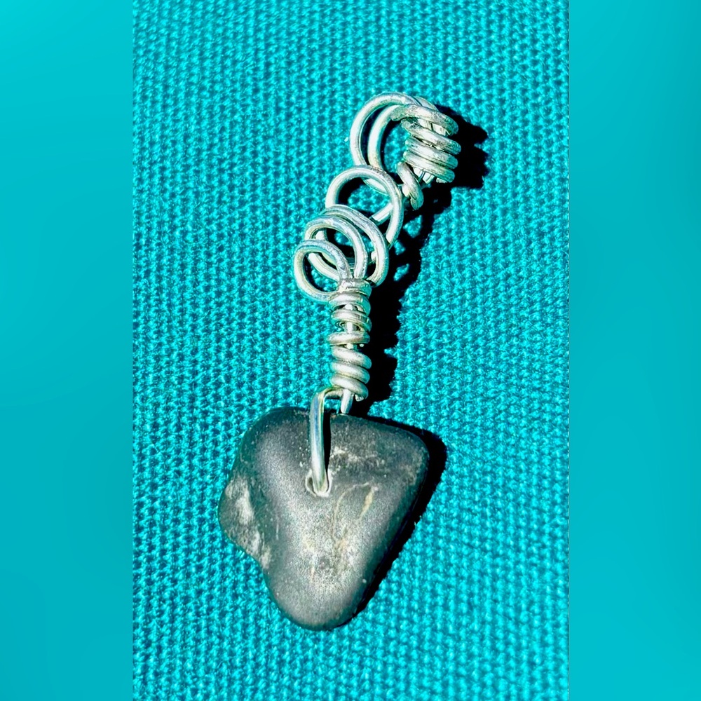Hand wire wrapped natural finger lakes lucky stone pendant.